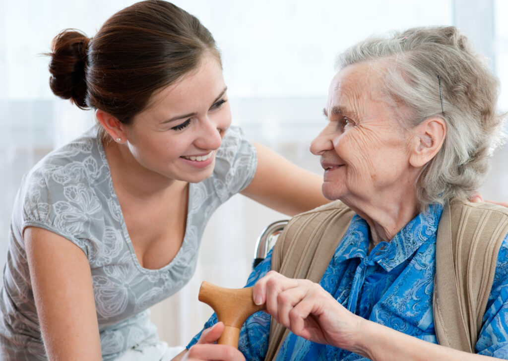 Senior woman with her home caregiver